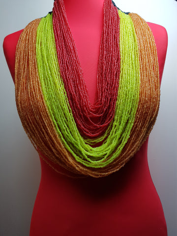 Handmade multi-layered necklace made with seed beads and crocheted wool.